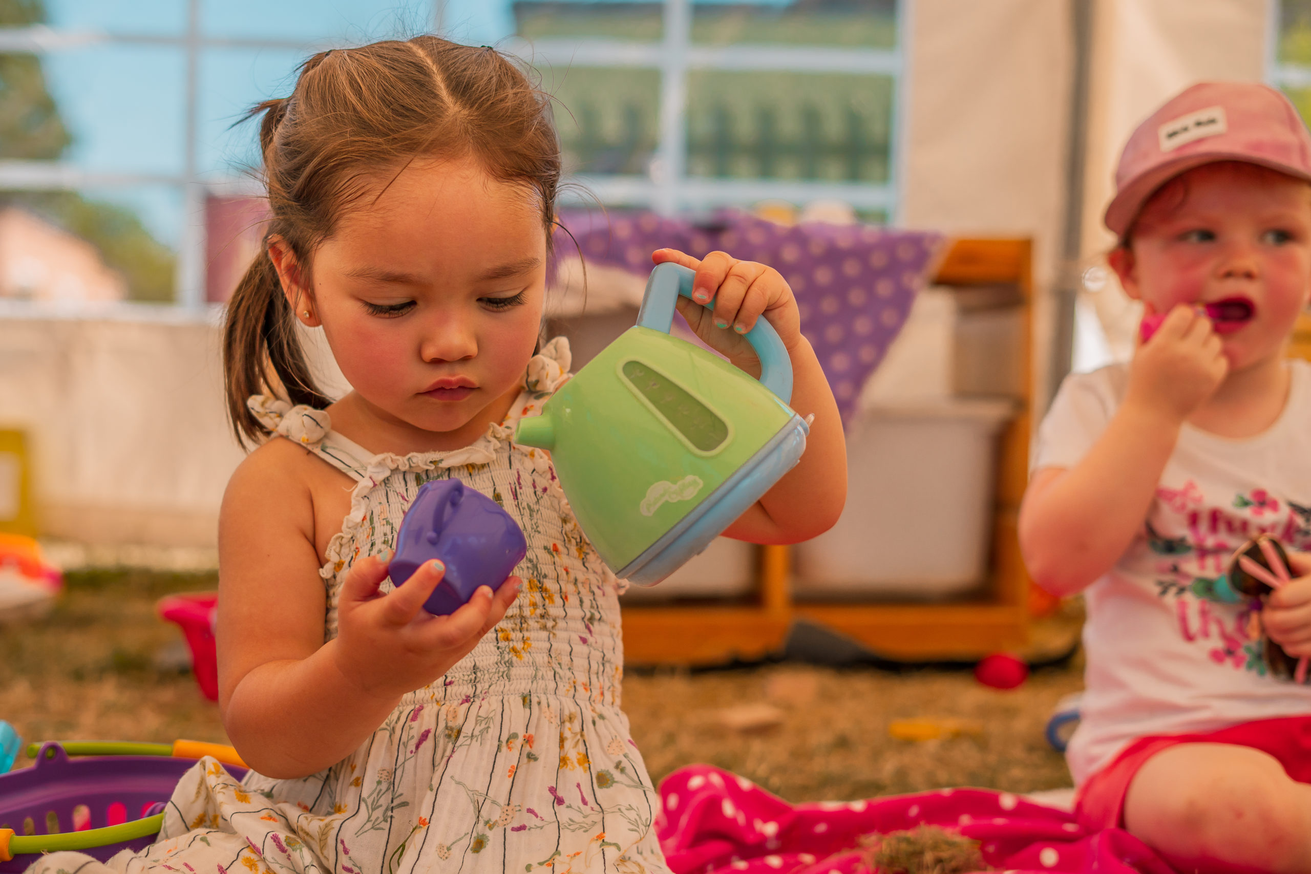 Girl playing with tea set