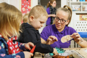 Child playing with carer